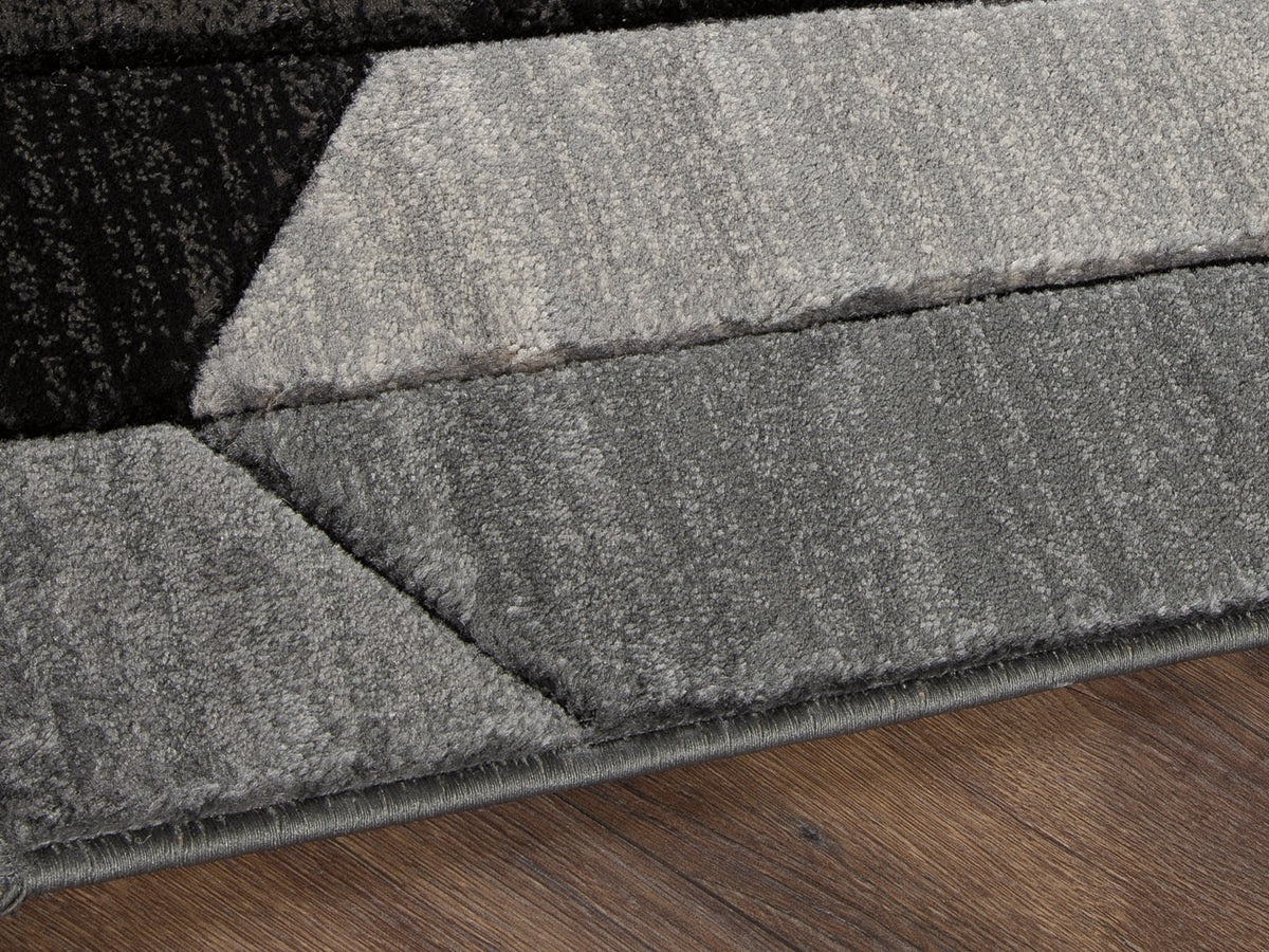Tampa Furniture Outlet - Ashley Furniture - Chayse Rug - 5' x 6'7" Rug / Black/Gray - R403462