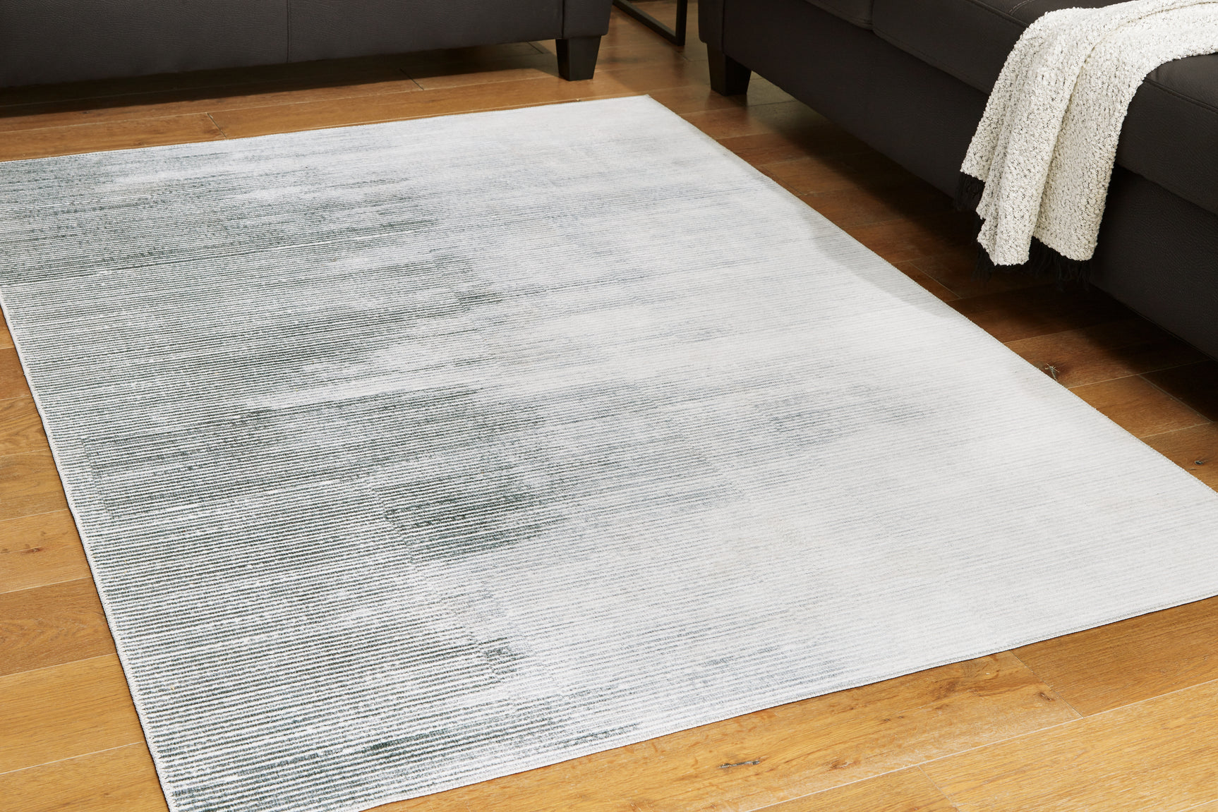 Tampa Furniture Outlet - Ashley Furniture - Milset Rug - 5'1" x 6'10" Washable Rug / Black/White/Gray - R406252