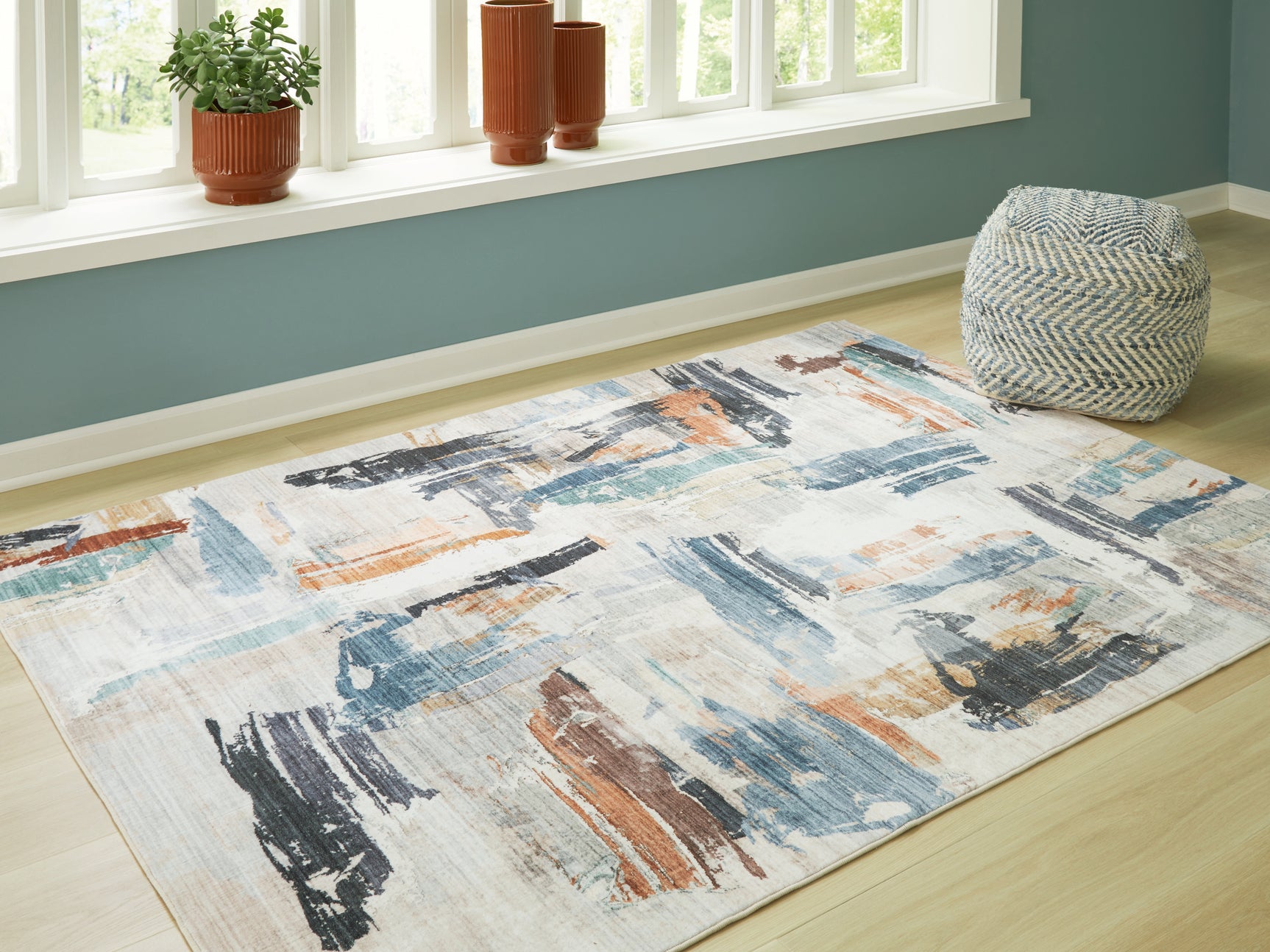 Tampa Furniture Outlet - Ashley Furniture - Hessland Rug - 5' x 7' Washable Rug / Multi - R407052