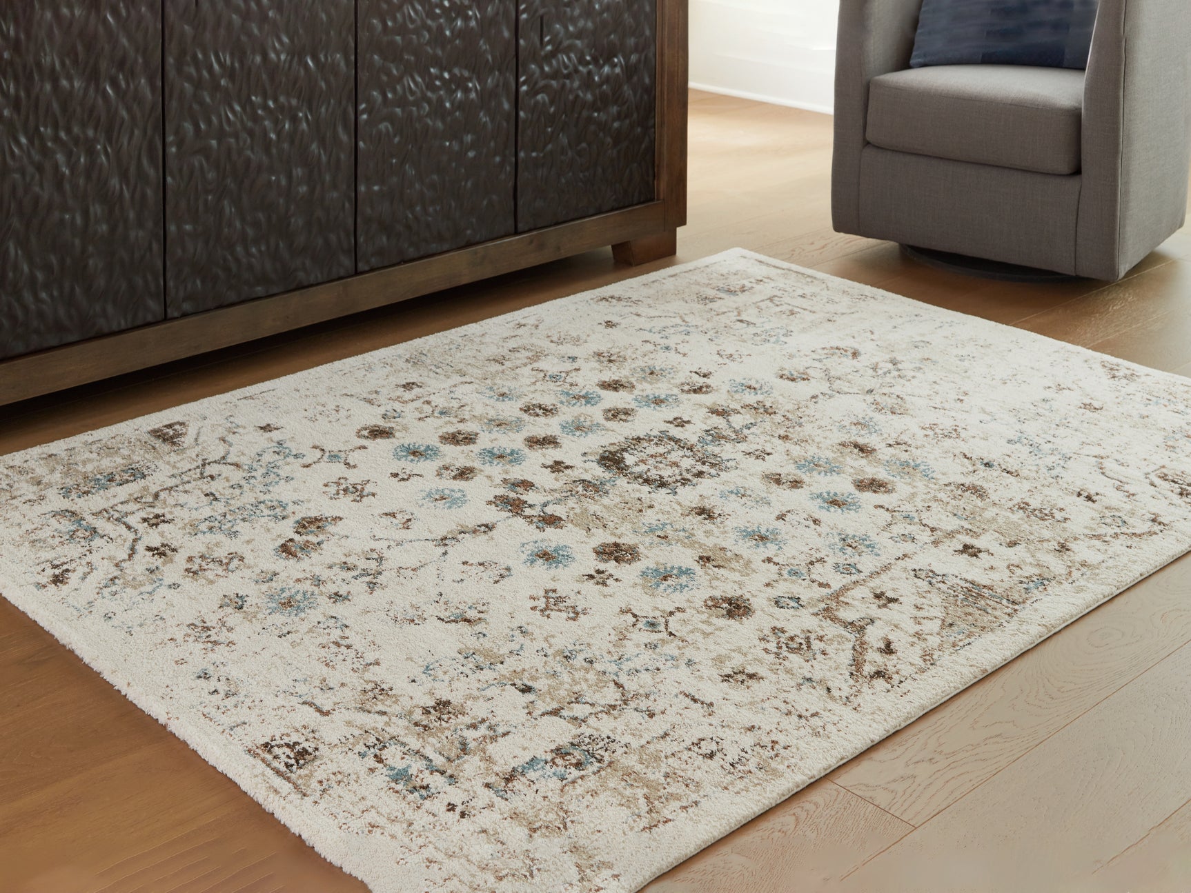 Tampa Furniture Outlet - Ashley Furniture - Jossler Rug - 5' x 7' Rug / Ivory/Brown/Teal - R407072