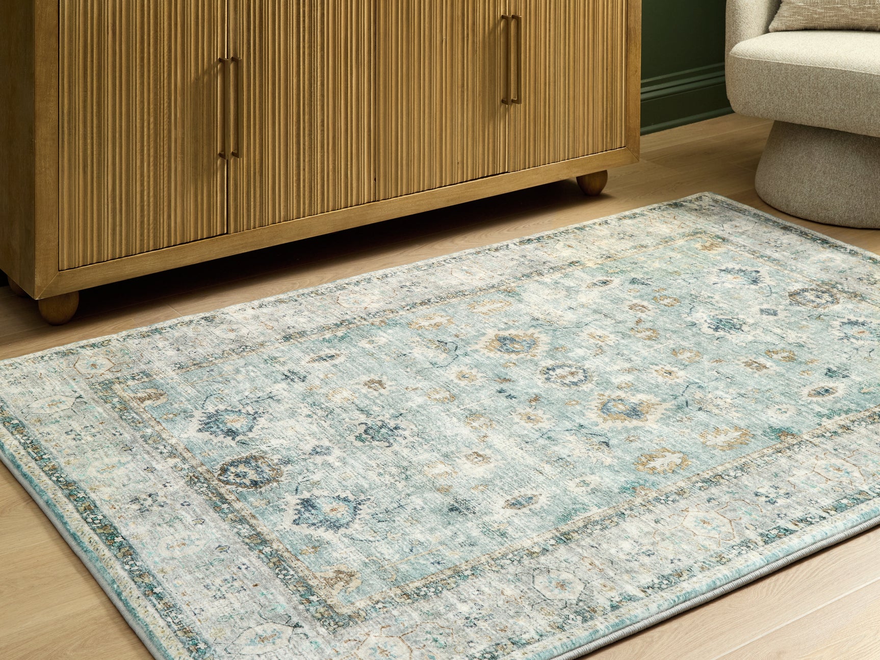 Tampa Furniture Outlet - Ashley Furniture - Ladstoney Rug - 5' x 7' Area Rug / Teal/Beige/Ochre - R407502