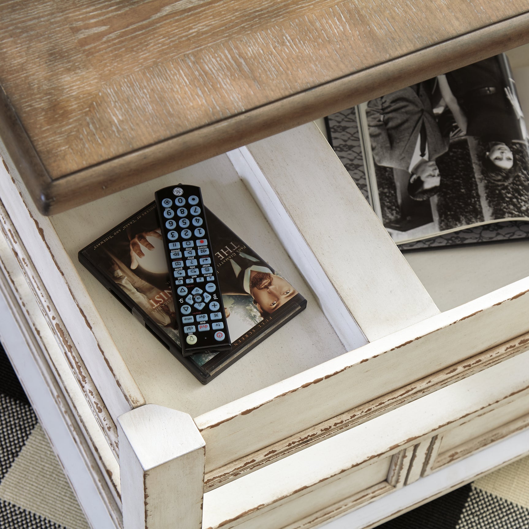 Realyn Coffee Table with Lift Top - Tampa Furniture Outlet