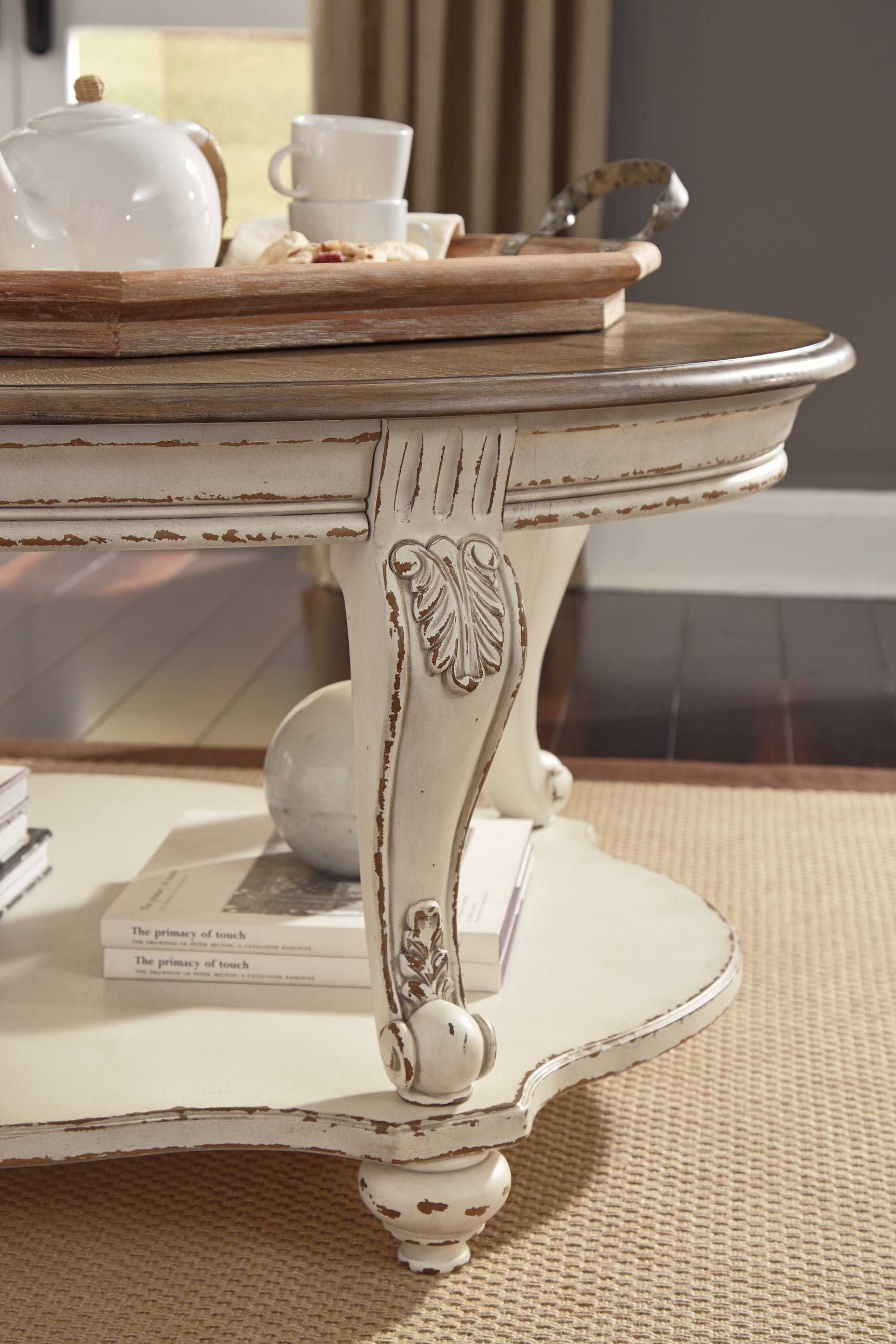 Realyn Coffee Table - Tampa Furniture Outlet