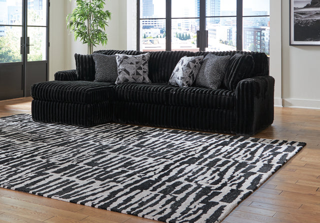 Tampa Furniture Outlet - Ashley Furniture - Midnight-Madness Sectional - RAF 2-Piece Sectional Sofa with Chaise / Onyx - 98103S1