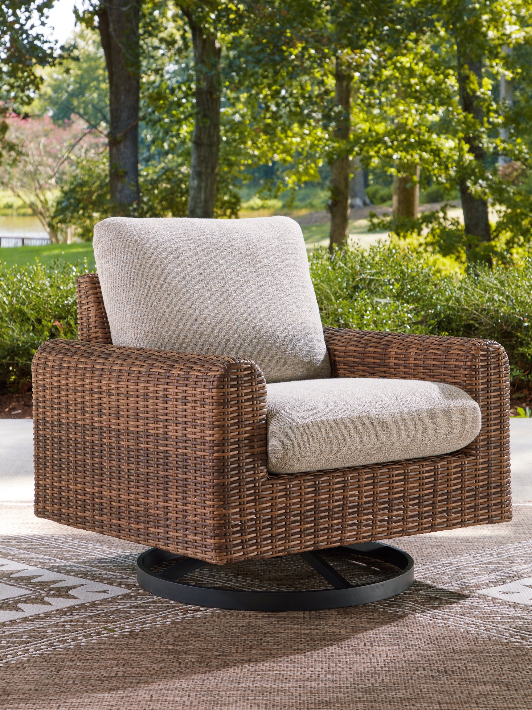 Tampa Furniture Outlet - Ashley Furniture - Dolan Creek Outdoor - Swivel Lounge w/ Cushion / Gray/Brown - PCP610-821