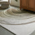 Tampa Furniture Outlet - Ashley Furniture - Rizwana Rug - 7'6" x 10' Area Rug / Ivory/Brown/Gray - R407761